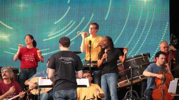 Vocalist Bobby McFerrin performs with the Silk Road Ensemble. The Iranian kemancheh player Kayhan Kalhor is bottom left.